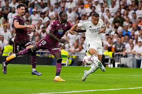 La liga 2024-25: Real Madrid's Kylian Mbappe, right, and Valladolid's Amath Ndiaye challenge for the ball